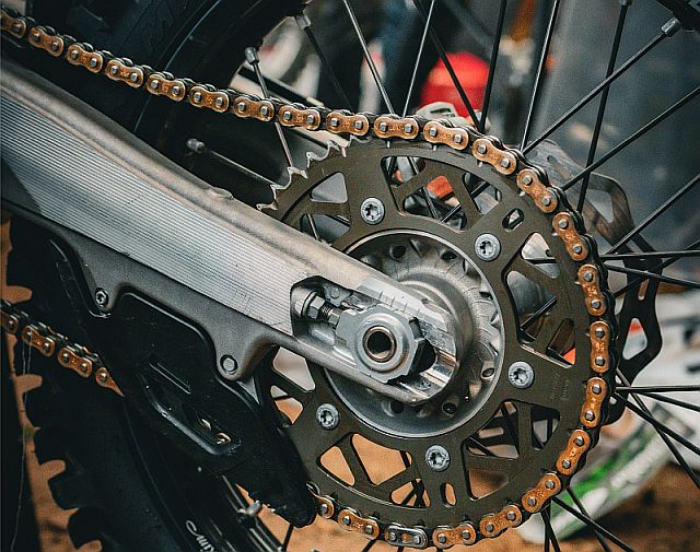 Image of a motorcycle rear fork and sprocket